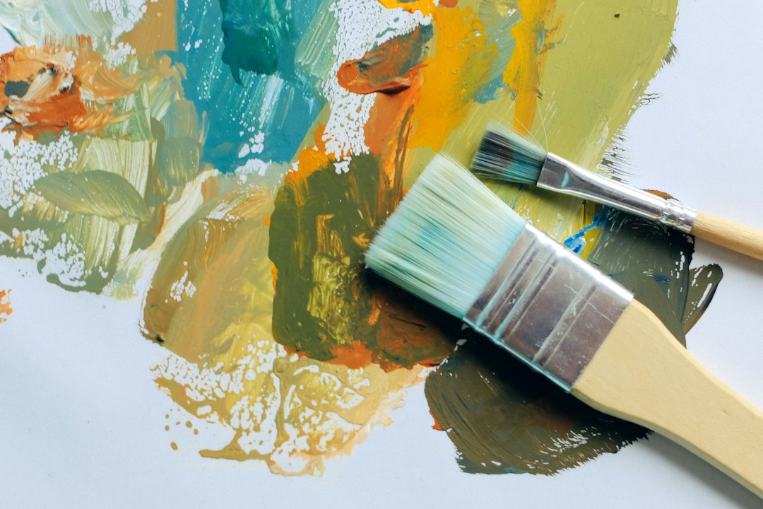 Two paintbrushes with different colors of paint on them in Torrance, CA